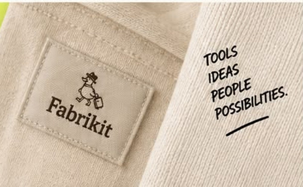 Fabrikit fabric label on a cream garment